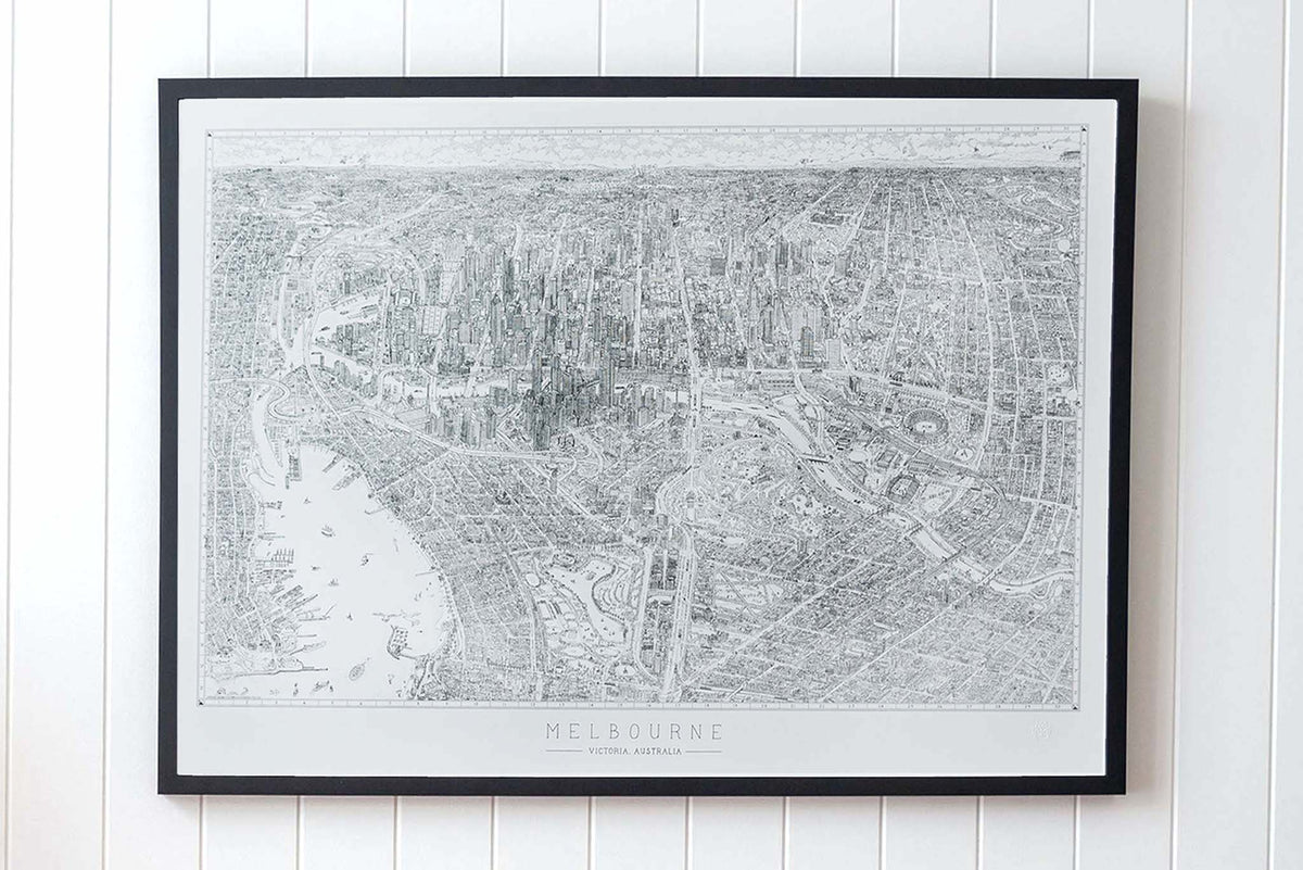 The Melbourne Map Black and white line drawing shown in a large version of the open edition. Framed in black and hanging on a panelled wall in a bright, airy room.