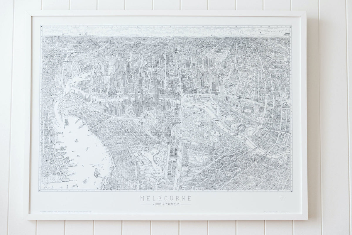 The Melbourne Map Black and white line drawing shown in a large version of the open edition. Framed in White and hanging on a panelled wall in a bright, airy room.
