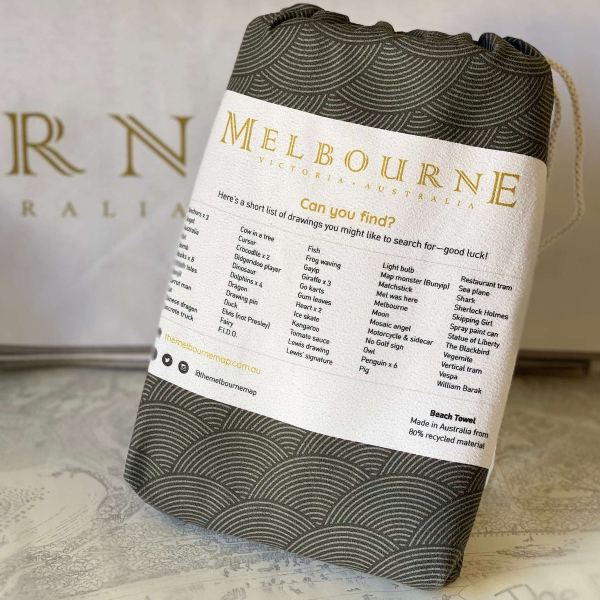 The reverse side of the bag which contains The Melbourne Map Beach Towel. The bag features the &quot;Can You Find?&quot; list. Making the towel interactive fun at the beach. 